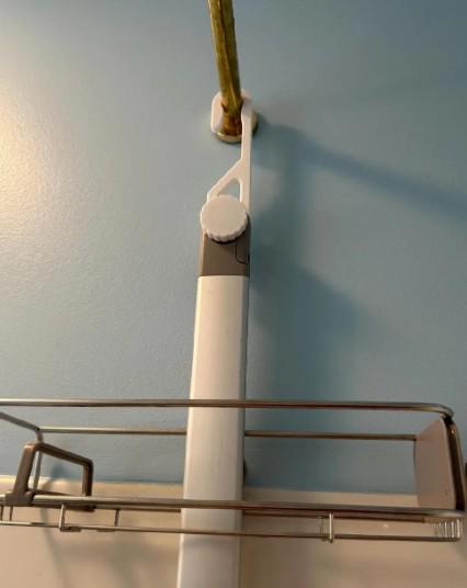 Wide-hook white shower caddy extension hanger installed on shower Brass Rain shower head with SimpleHuman style Caddy