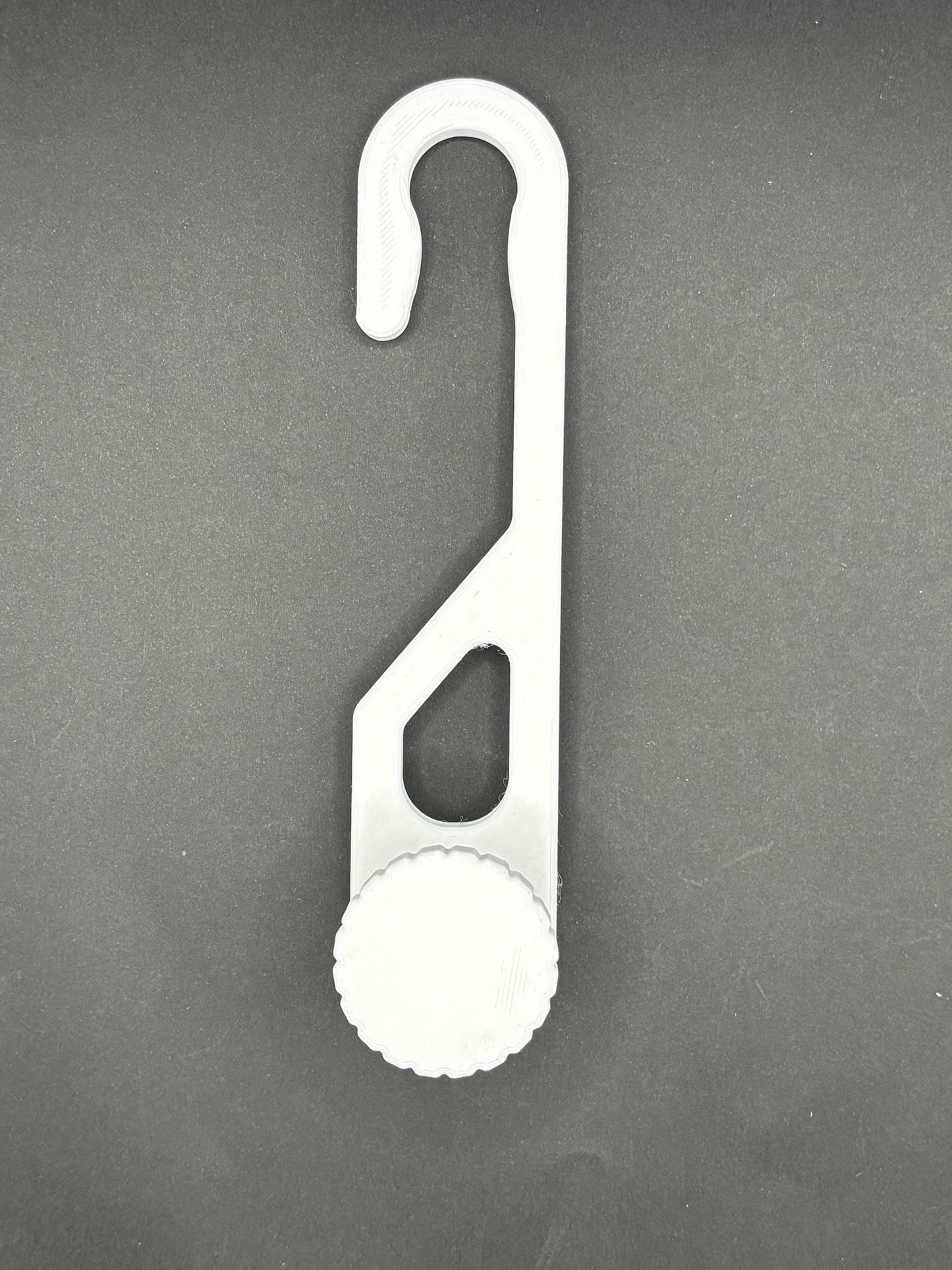 Standard-hook white shower caddy extension hanger with adjustment knob in studio lighting on black background.