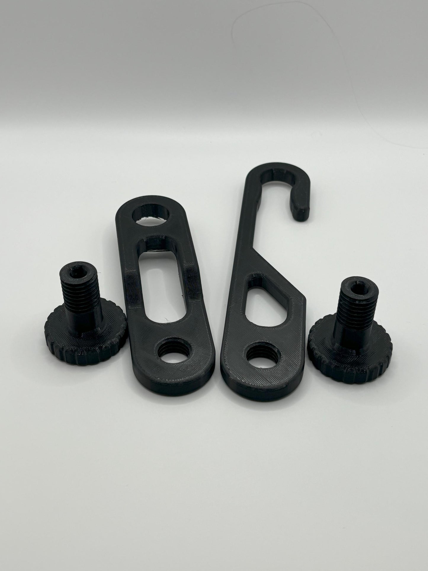 Dual-knob black shower caddy extension hanger studio parts lay out, includes standard hanger, 4.5inch additional extender and hanging knobs.