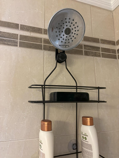 Standard-hook black shower caddy extension hanger mounted on angled shower arm in tiled bathroom.
