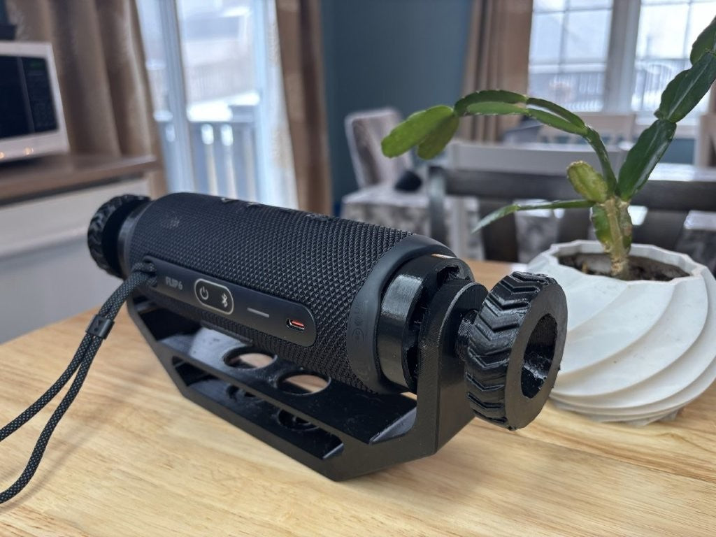 Adjustable speaker mount installed for off-road use, suitable for ATV, UTV, and side-by-side vehicles, holding a JBL Flip 6 style speaker securely with base with no trim package