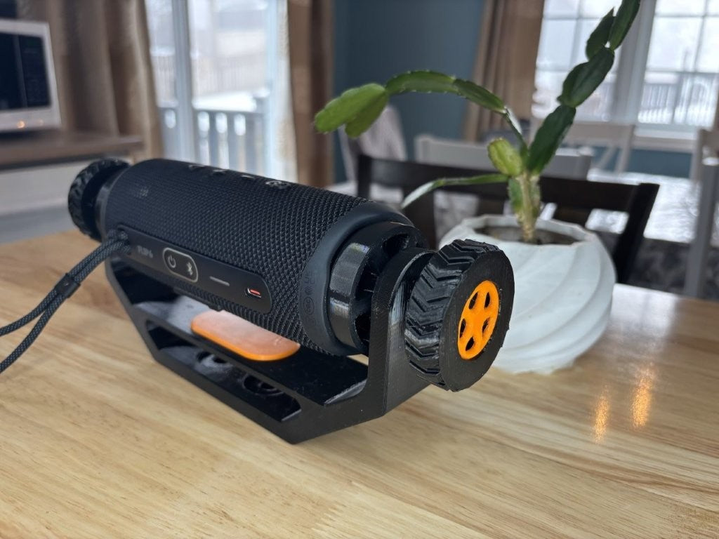 Adjustable speaker mount suitable for wall mount, deck mount, ATV, UTV, and side-by-side vehicles, designed to hold for JBL Flip 6 style speaker securely with orange trim package