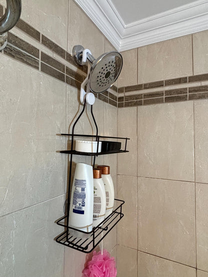Standard-hook white shower caddy extension hanger installed on shower pipe holding full-length hanging caddy