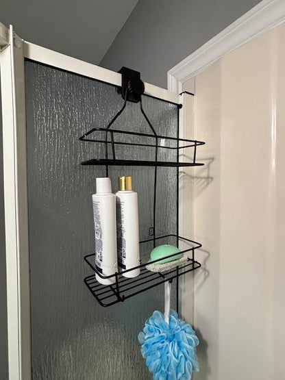 Angled view of black shower caddy adapter showing how it attaches to a shower divider