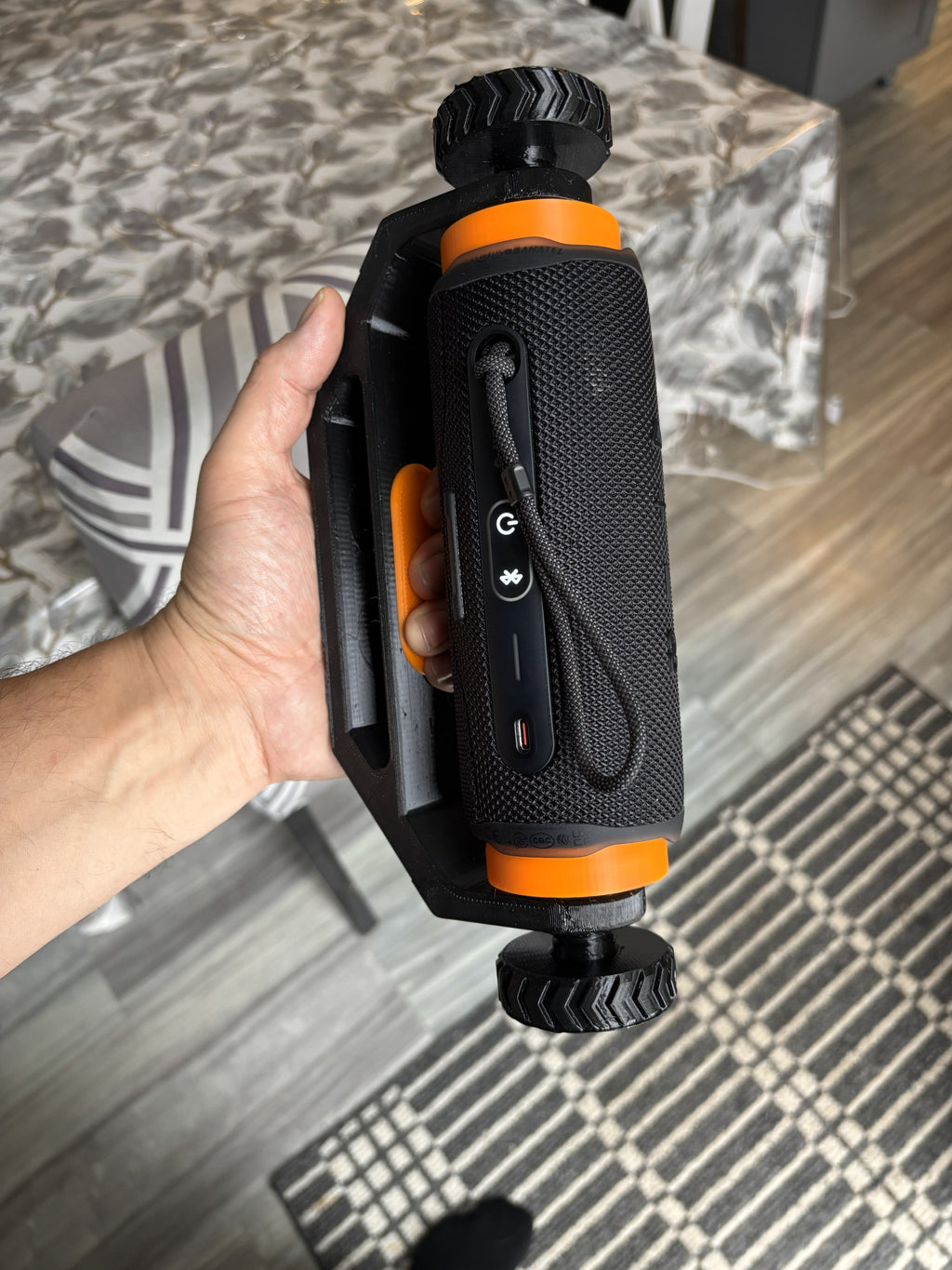 Adjustable 3D printed speaker mount designed for JBL Flip 6 style speakers, shown mounted horizontally for ATV, boat, RV, or outdoor use.